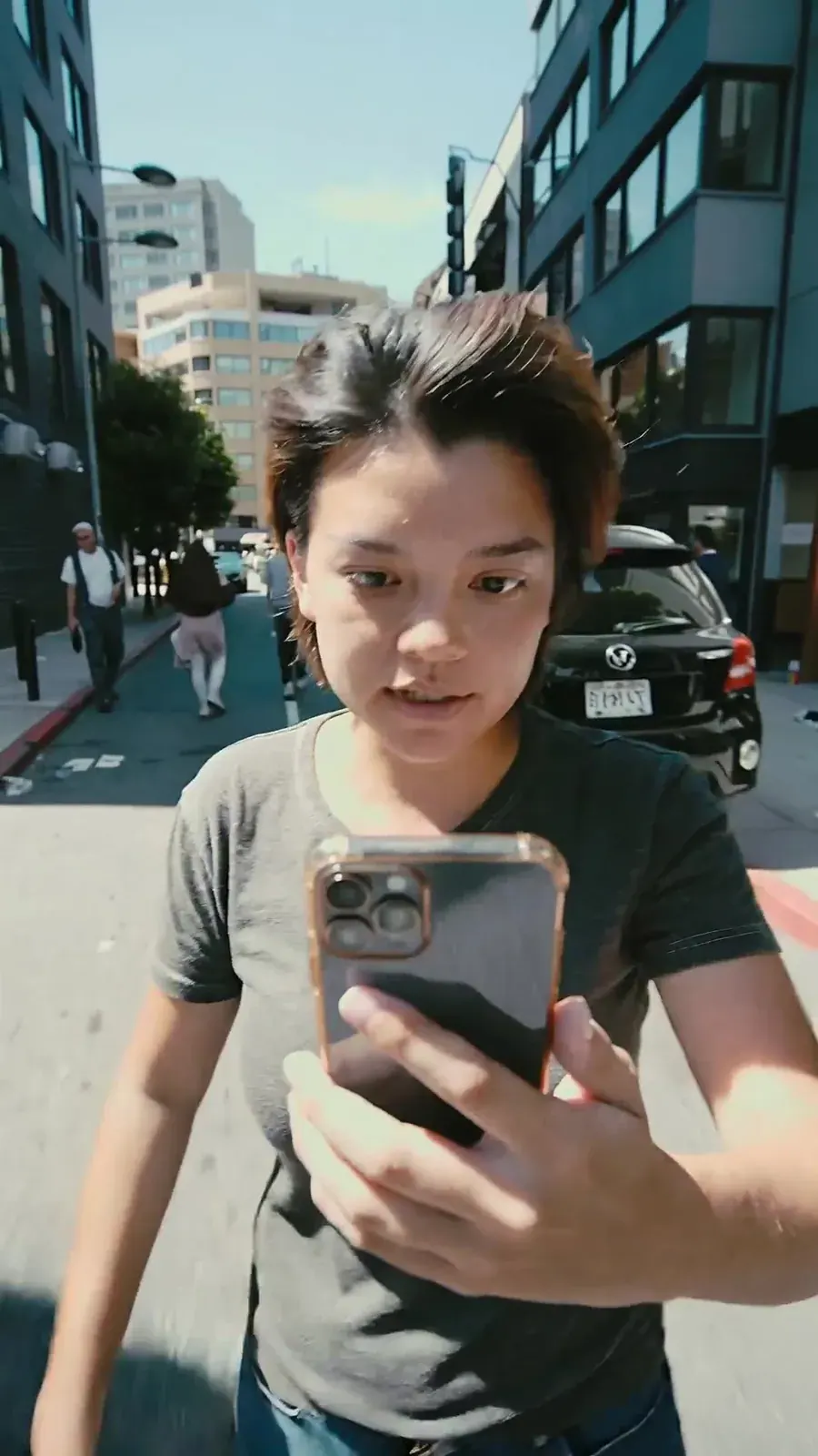 Kling 2.5 Turbo prompt idea: a woman vlogging on her phone on a sunny street, vertical