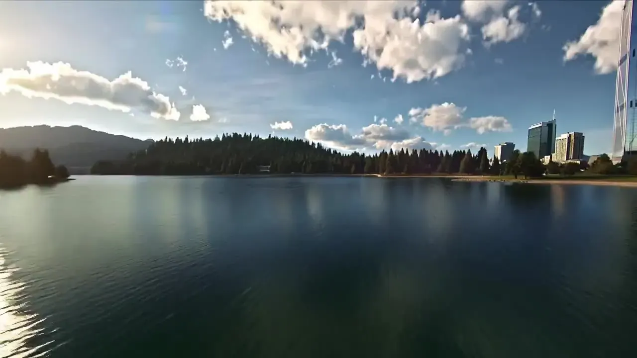 Kling 2.5 Turbo prompt idea: a drone flight over a lake up a glass skyscraper