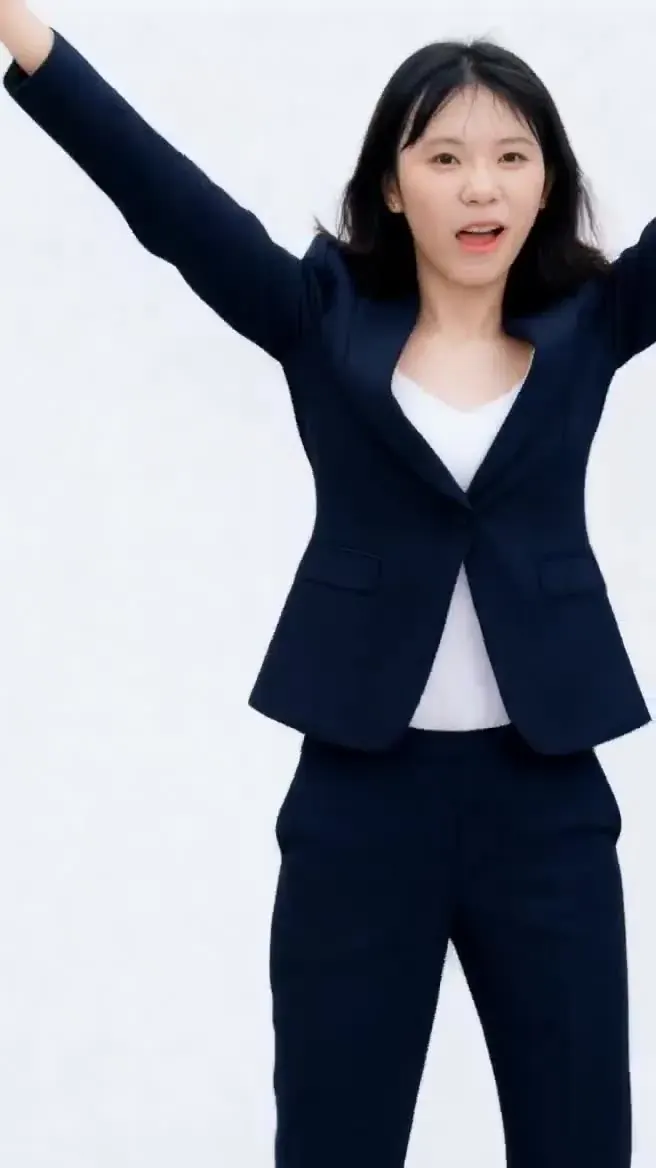 Kling motion control illustration, pose 1: the woman from the photo doing the same arms-up dance in her navy suit